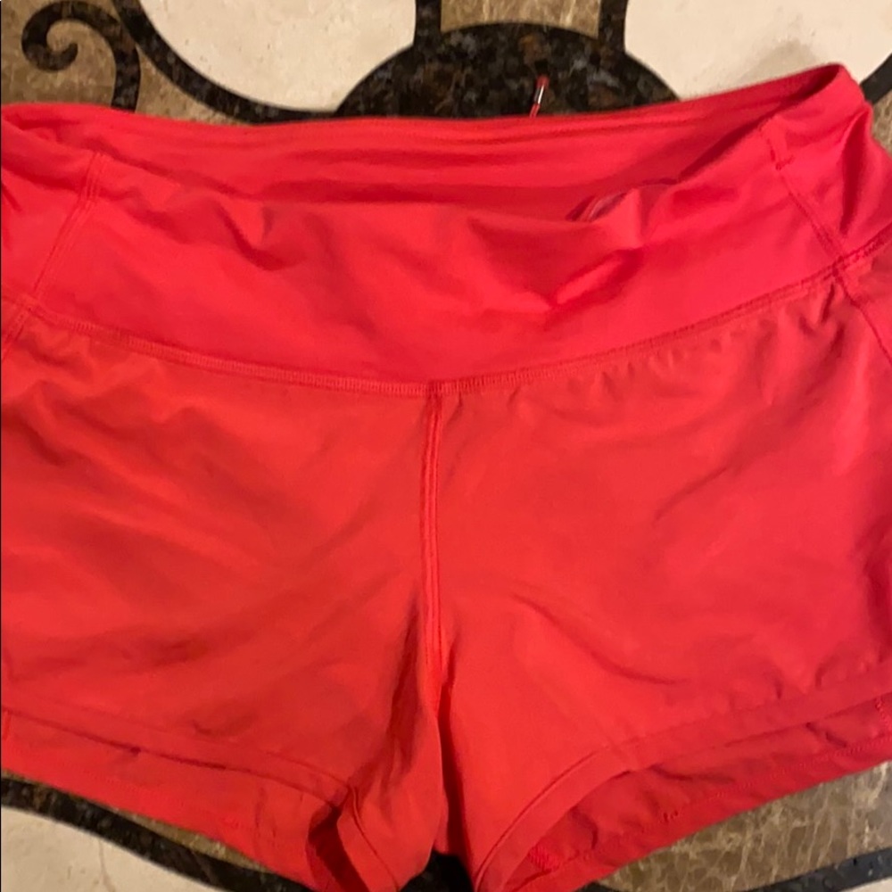 Bright pink/orangey Lululemon size 4 speed up short